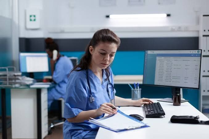Clinical staff reviewing patient data together